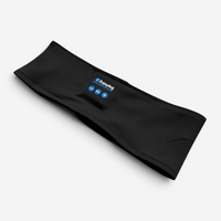 Masque de sommeil en bandeau Bluetooth noir Deskium posé à plat, vue de trois quarts